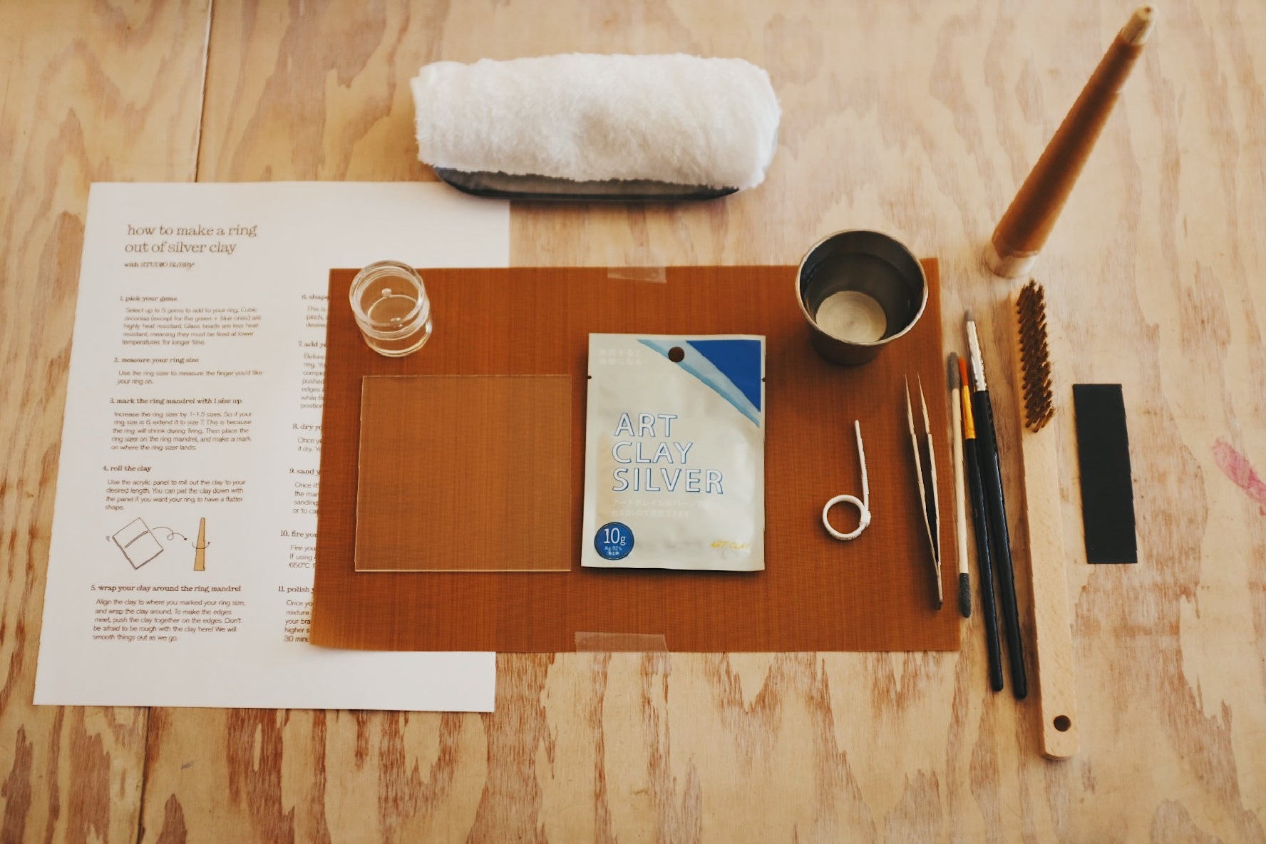Set of tools and materials for metalworking on a wooden surface